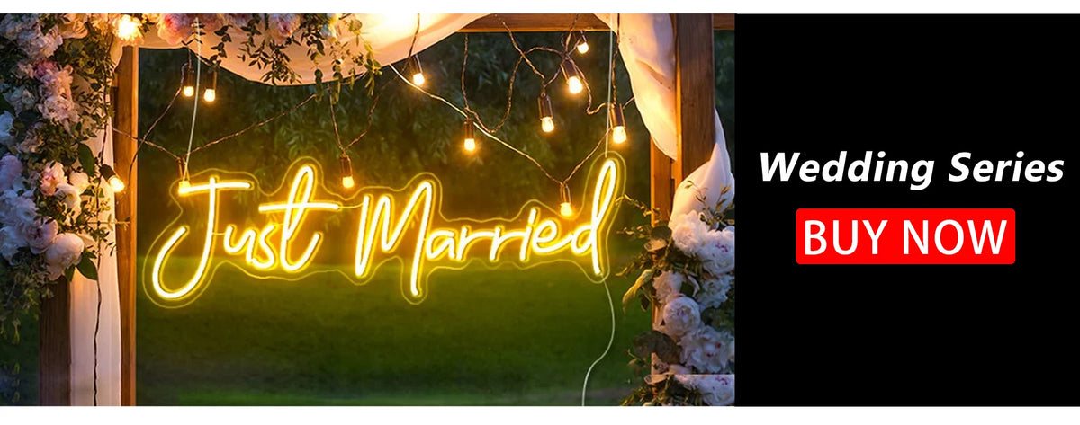 A glowing neon sign spelling Just Married is displayed outdoors with greenery and warm string lights.