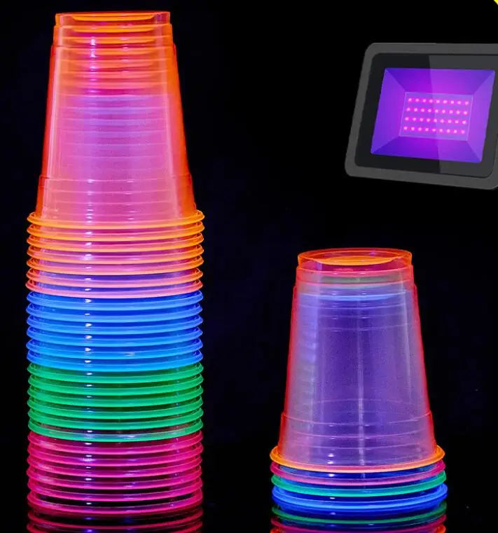 A vertical stack of neon glow plastic party cups in various colors, including pink, blue, green, and purple.