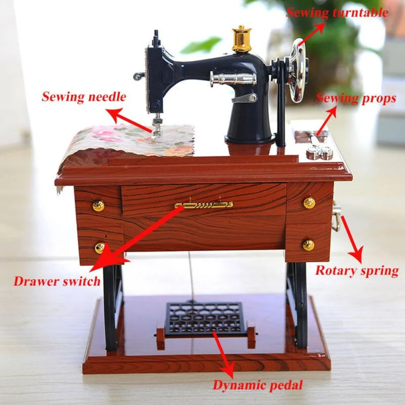 A vintage sewing machine music box featuring a dark body, wooden base, and various components like a sewing turntable and dyn