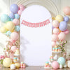A white arch backdrop decorated with pink bunting and balloons for a baby shower or wedding party.