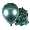 A single silver-blue latex balloon is shown next to a bunch of crinkled dark green foil balloons.