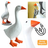 White resin goose figurine with an orange beak and feet, shown alongside a magnetic key holder.