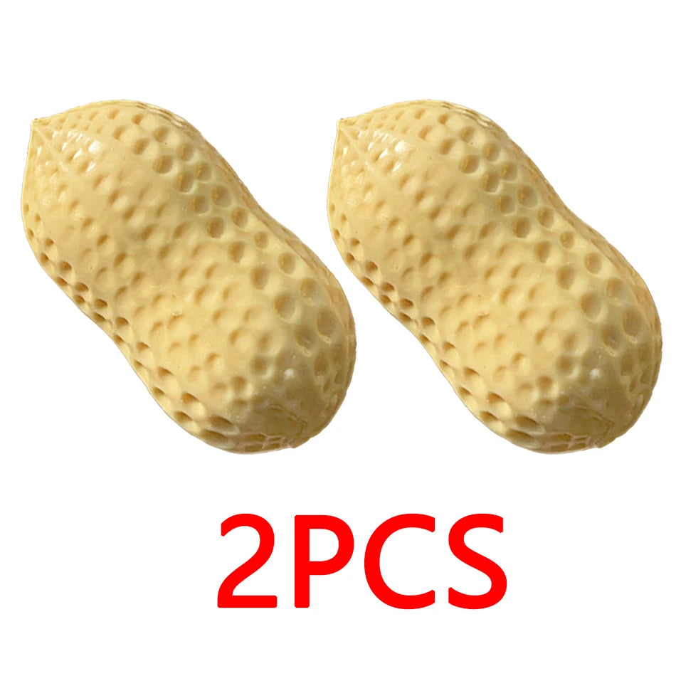Two light yellow, peanut-shaped stress balls with a textured surface.