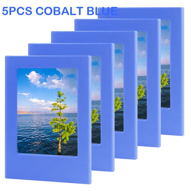 Five cobalt blue magnetic photo frames displaying a scenic landscape.