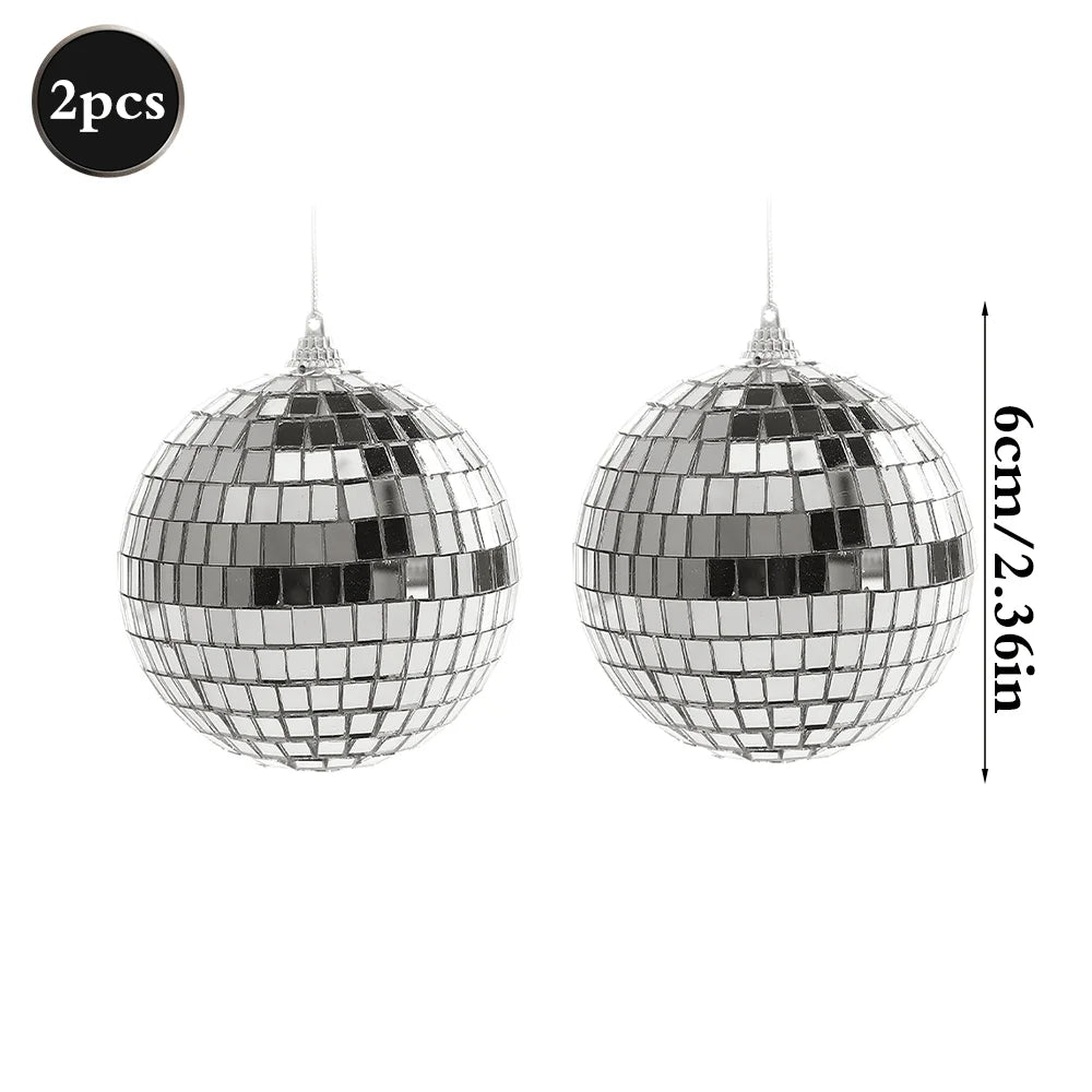 A silver mirror ball sphere with a hanging hook, showing its reflective, faceted surface.