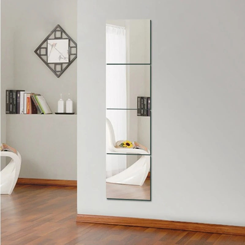 A vertical acrylic mirror wall sticker set displayed on a white wall next to a wooden floor.