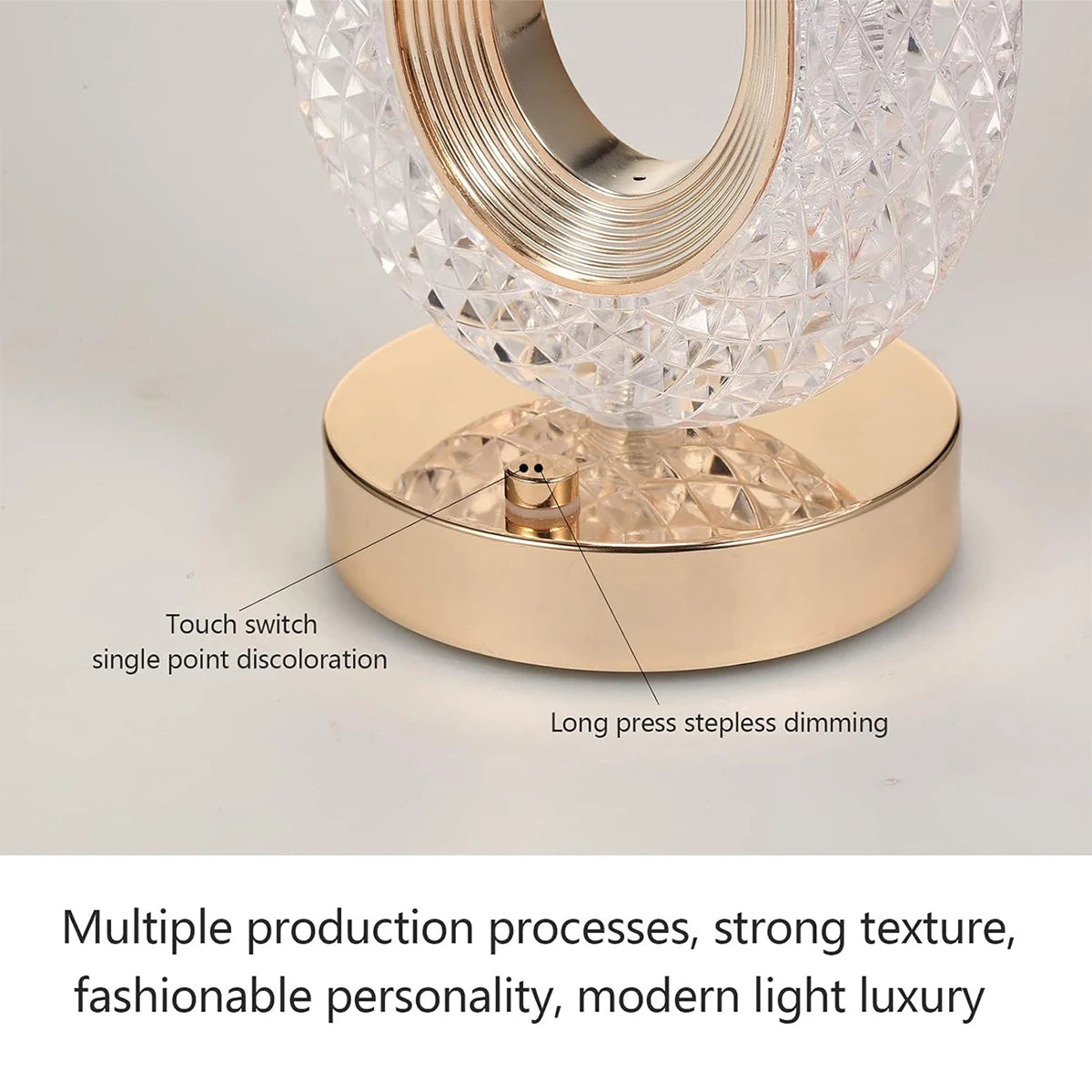 A close-up view of an oval crystal LED table lamp with a gold base and textured glass shade.