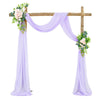Elegant chiffon purple drapes forming an arch for a wedding or event backdrop