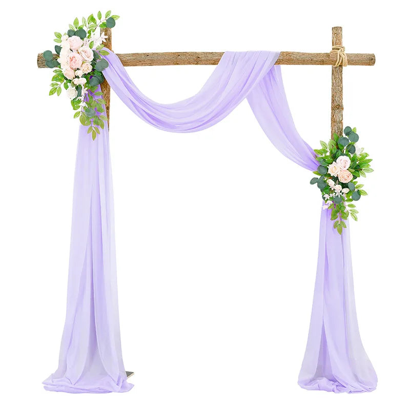 Elegant chiffon purple drapes forming an arch for a wedding or event backdrop