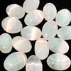 A collection of oval, translucent white to pale green selenite palm crystals.