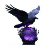 A black raven sculpture with purple glow perched atop a dark, textured base.