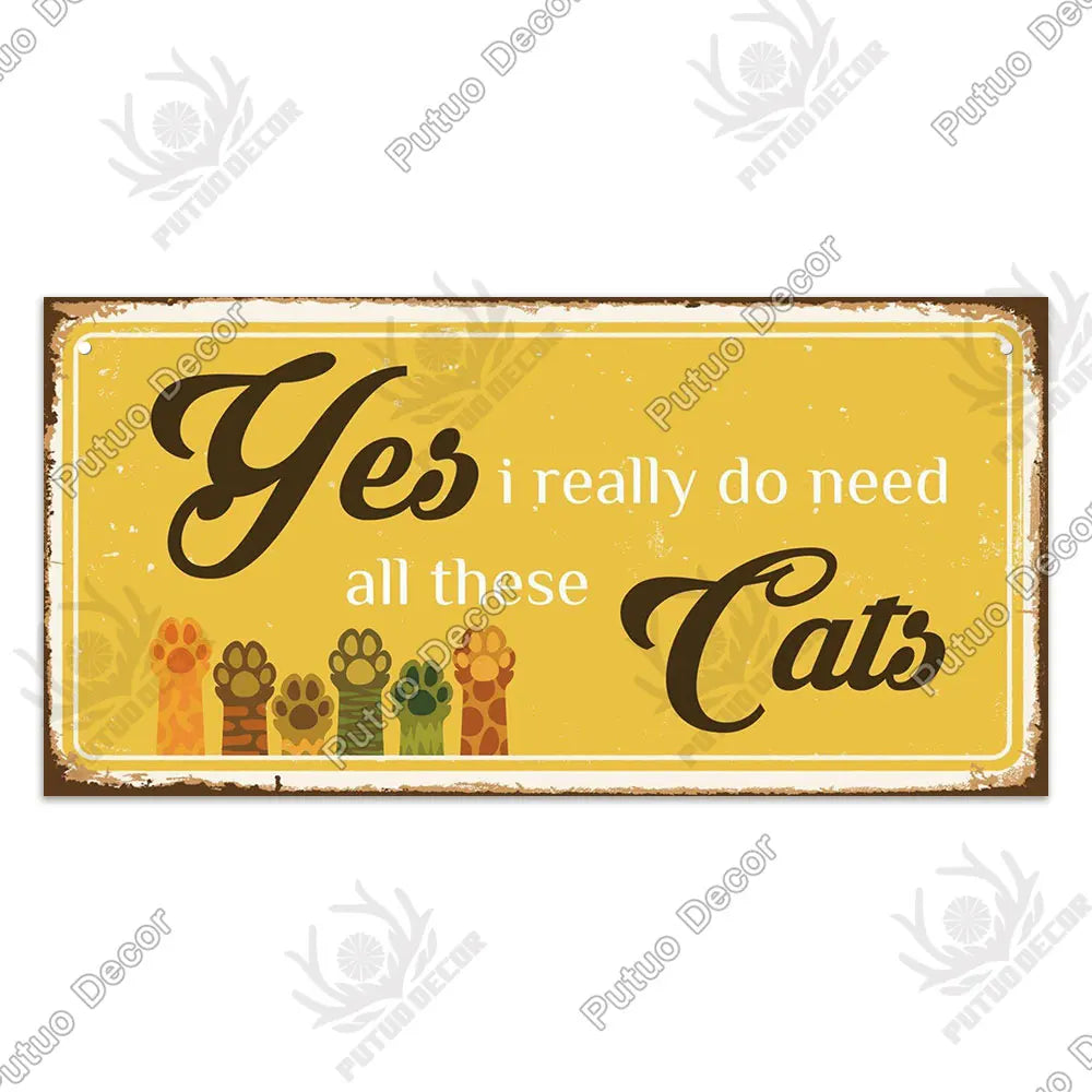 A rustic wooden sign with the text Yes i really do need all those Cats written in elegant script.