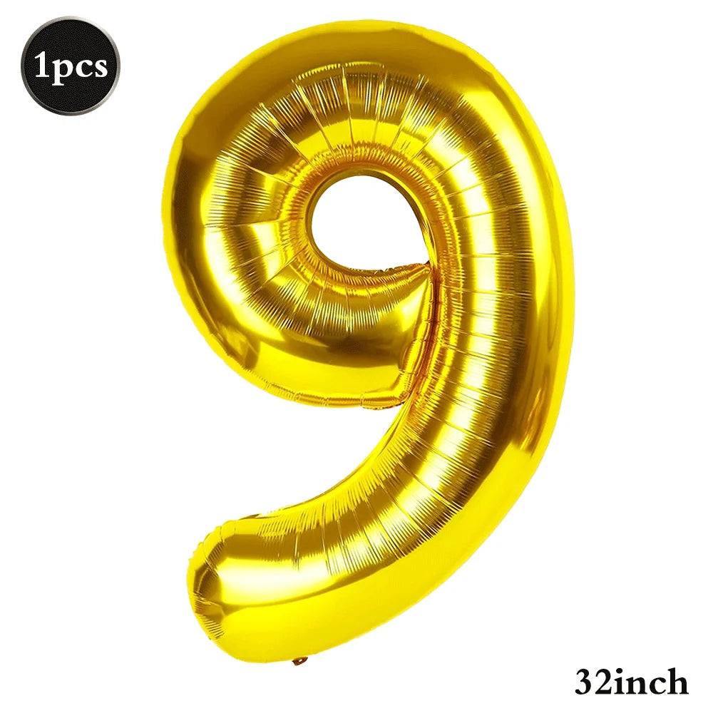 A shiny gold foil number balloon shaped like the numeral 9, measuring 32 inches.