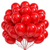 A cluster of bright red round latex balloons tied together.
