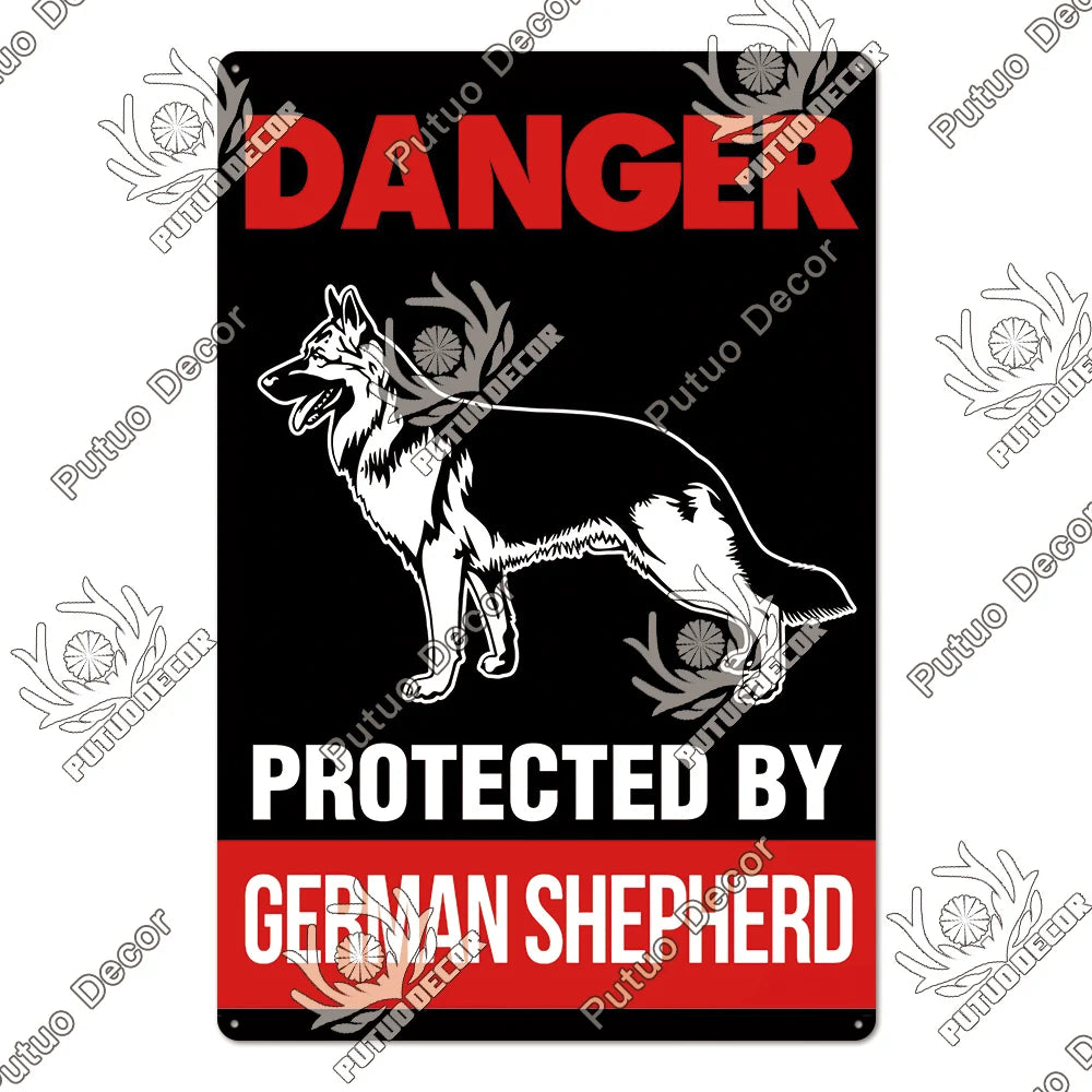 A vintage warning metal sign featuring a silhouette of a German Shepherd dog on a black background with red text reading DANG