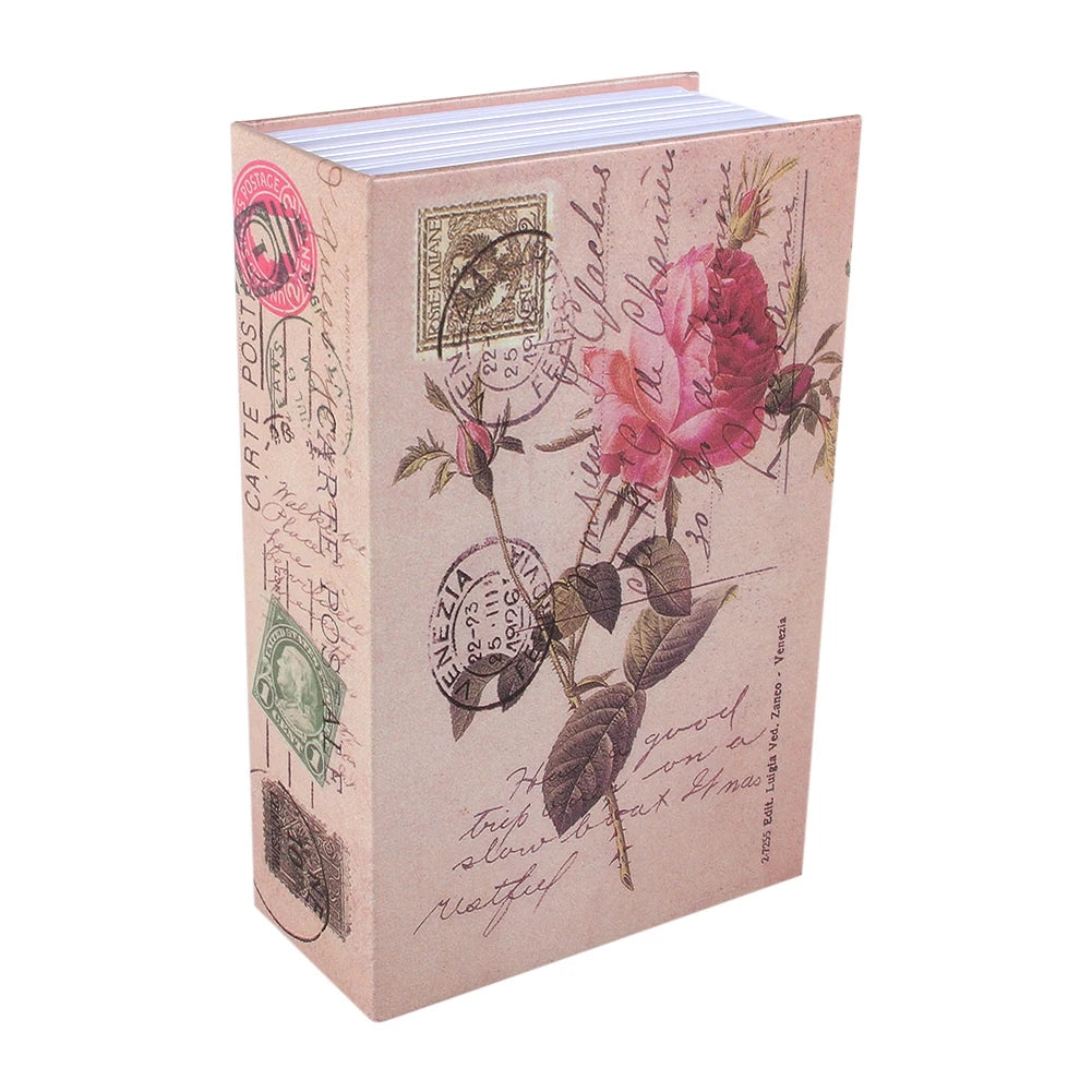 A pink-toned dictionary-style box with decorative stamps and text on the cover.