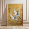 A vertical canvas print featuring two white cranes in flight against a golden textured background.