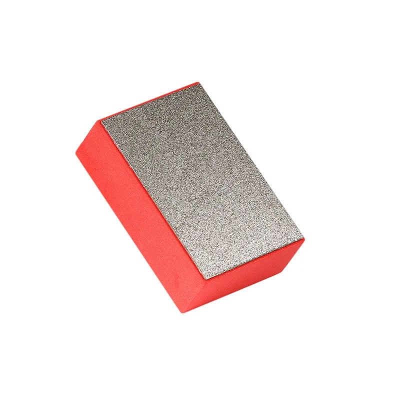 A rectangular polishing pad with a red base and a silver textured top.