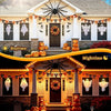 Halloween decorations featuring hanging ghosts and pumpkins with warm glow lighting for daytime and nighttime displays