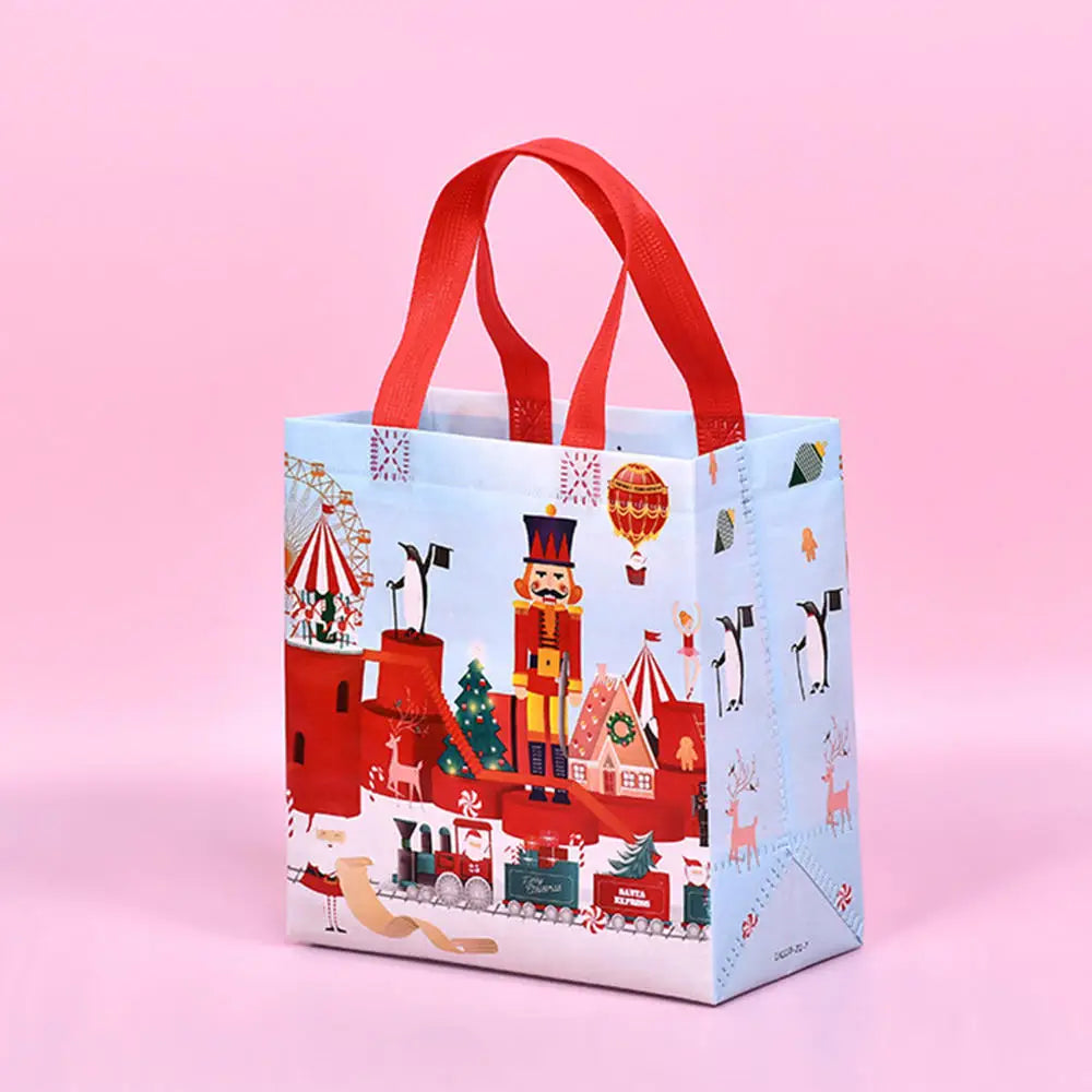A light blue non-woven gift tote bag with a red handle and festive Christmas holiday prints.