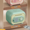 A pink and green fingerprint password piggy bank for kids displayed on shelves with money.