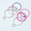 A set of six beaded bracelets featuring various pastel colors including pink, purple, and yellow, with a star charm and a hea