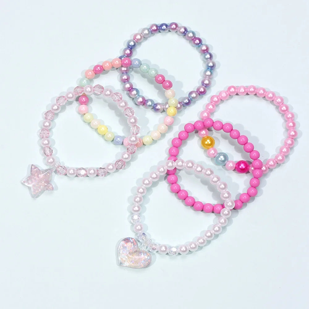 A set of six beaded bracelets featuring various pastel colors including pink, purple, and yellow, with a star charm and a hea