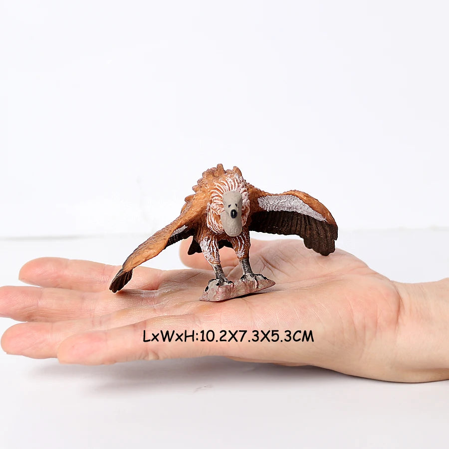 A realistic figurine set featuring an owl, vulture, and bald eagle perched on a human hand.