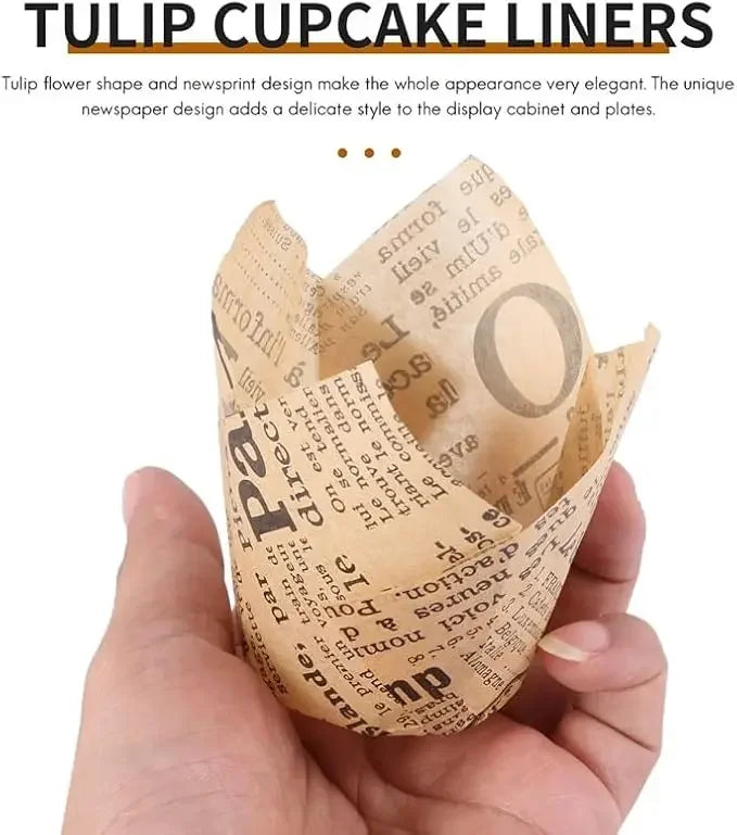A hand holds a sheet of tulip flower shaped newspaper style cupcake liners.