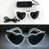 Pair of heart-shaped light up glasses with black lenses and silver frames