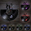 A collection of nine vintage vinyl record wall clocks featuring a jazz theme and a heart design.