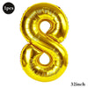 A large, gold foil number balloon shaped like the number 8.