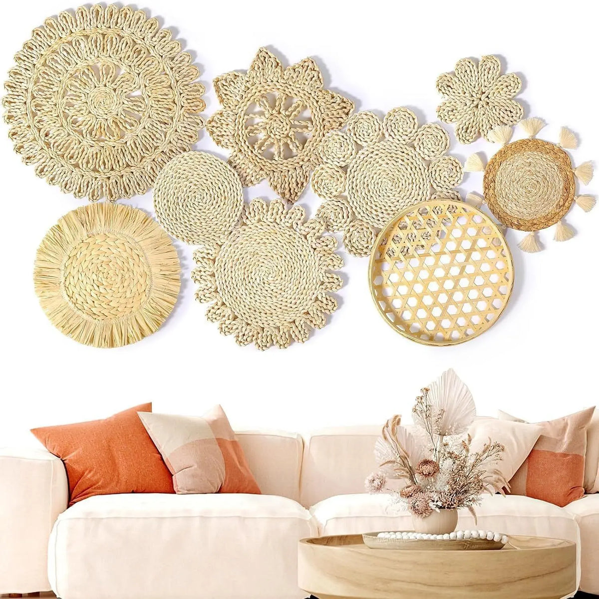 Boho straw wall hanging featuring woven circular patterns and tassels on a white wall.