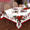White tablecloth with red poinsettia and holly print for a festive Christmas setting