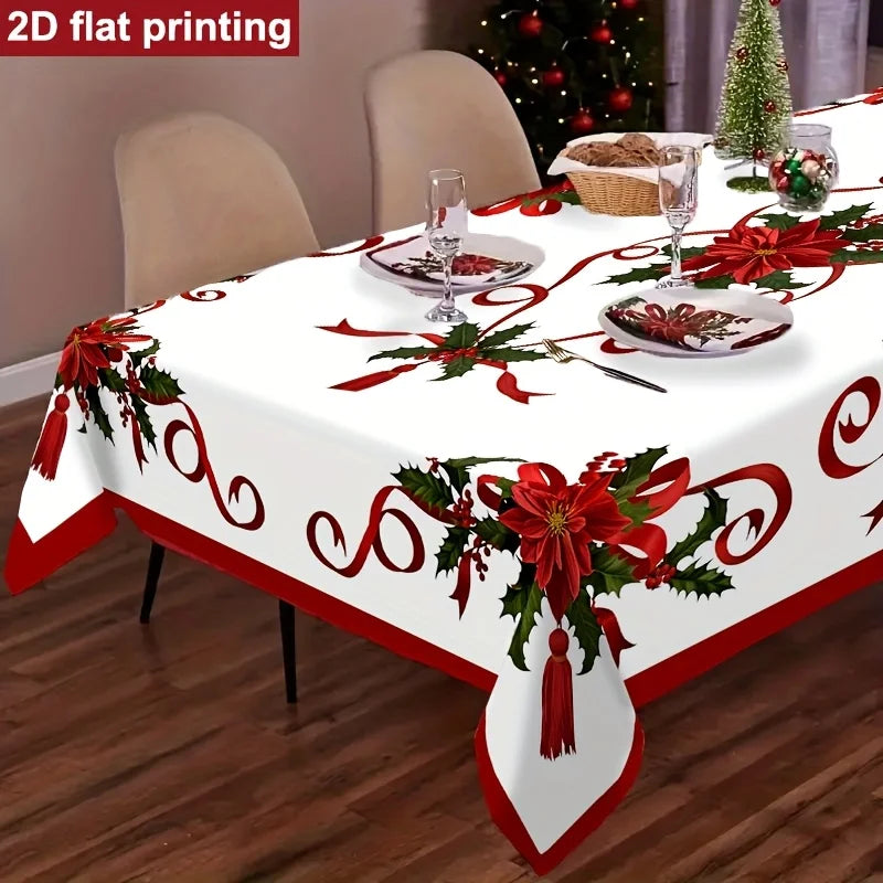 White tablecloth with red poinsettia and holly print for a festive Christmas setting
