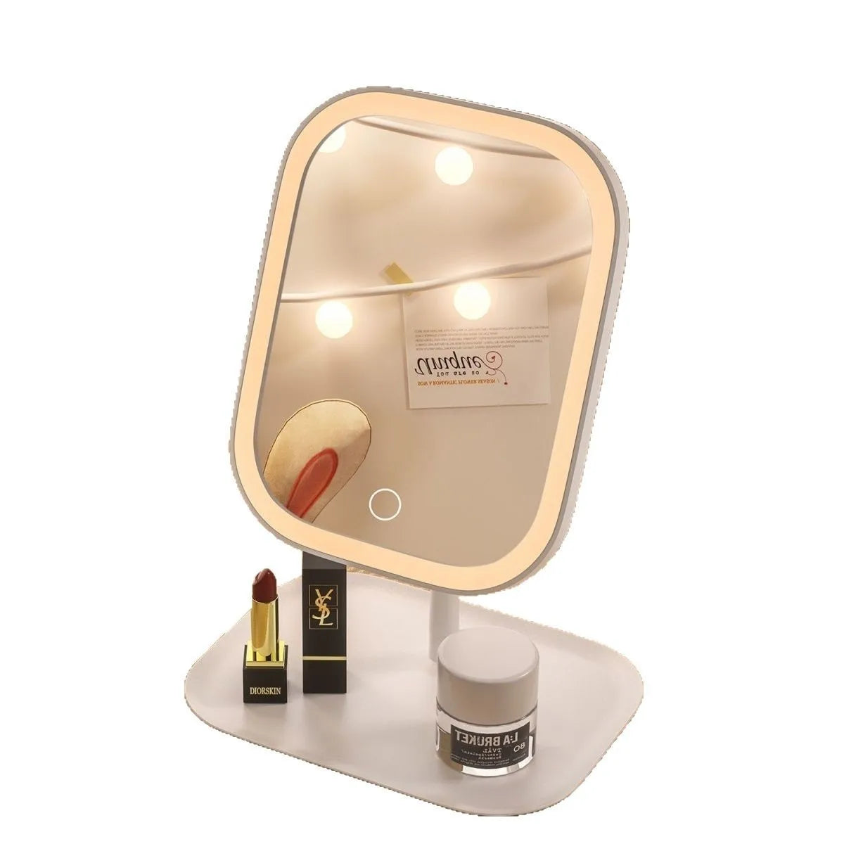A rechargeable LED vanity mirror with a rounded frame and touch controls resting on a light-colored surface.