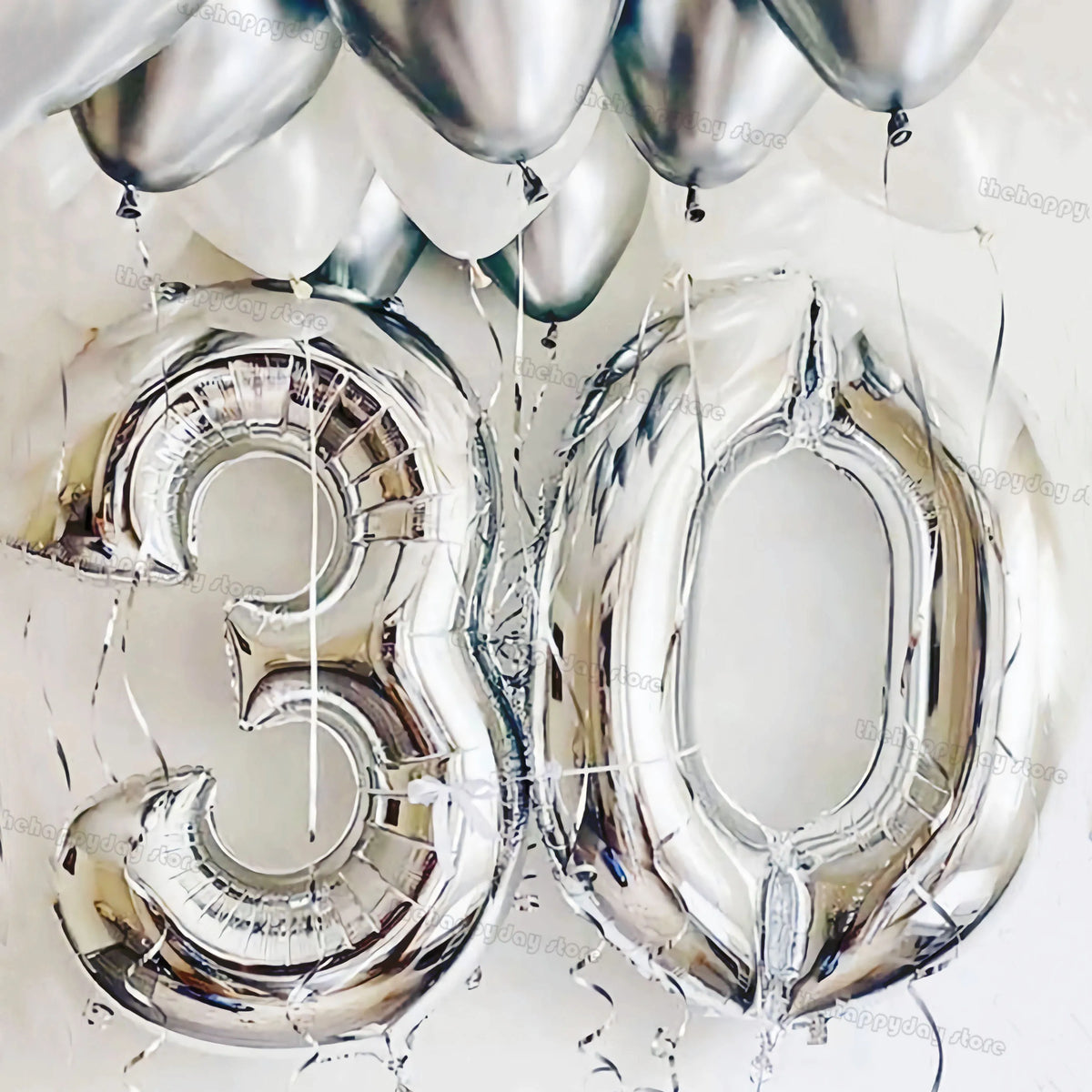 Metallic silver number foil balloons shaped like 30 for milestone celebrations