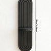 A vertical, dark wood wall shelf with a rounded arch design and ribbed texture.
