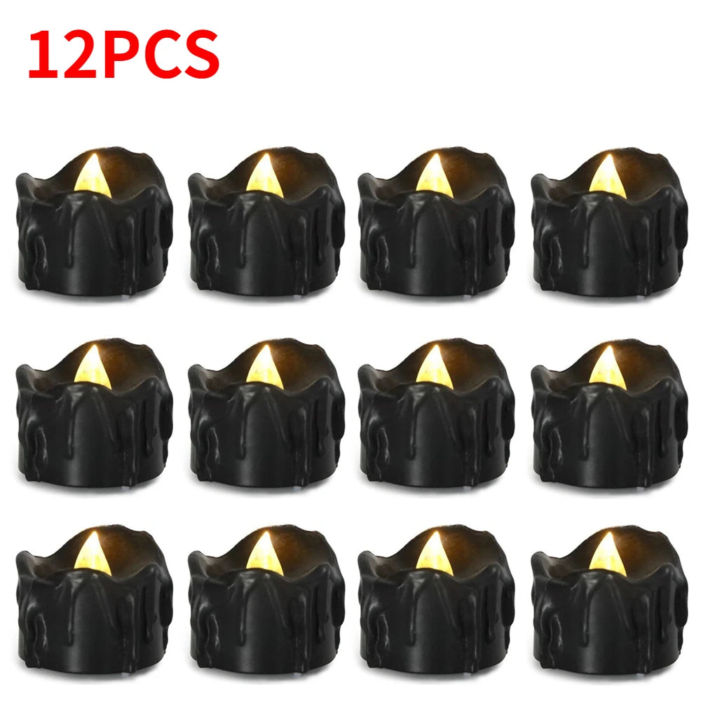Twelve black flameless LED candles with a warm white glow