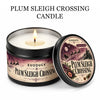 A dark tin candle labeled Plum Sleigh Crossing with a lit wick and an open lid.