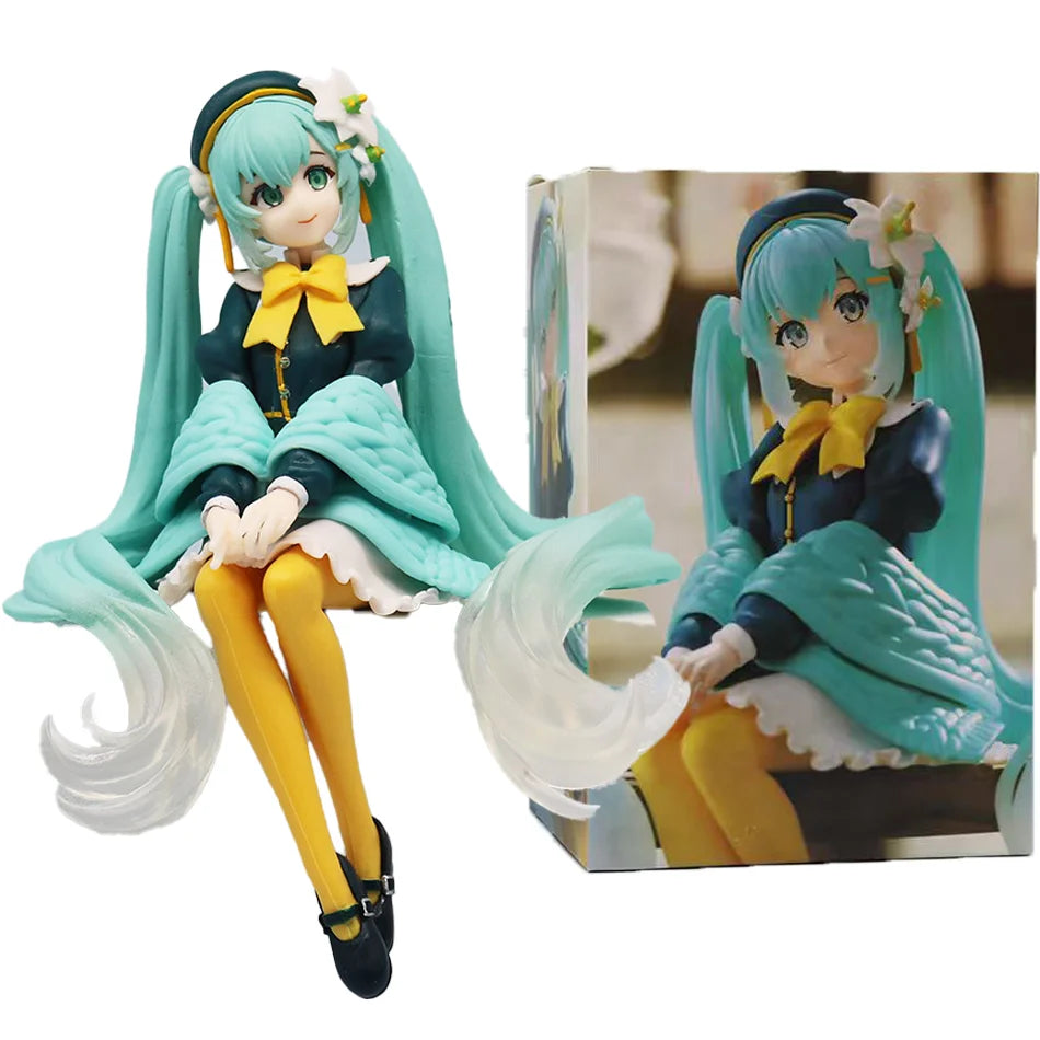 A PVC collectible figurine of Hatsune Miku in a school uniform with teal hair and yellow accents.