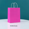 A bright pink disposable paper food tray with white handles against a teal background.