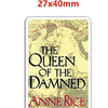 A rectangular gold-toned resin flatback charm featuring the title The Queen of the Damned by Anne Rice