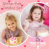 A set of glitter pink birthday candles and a pink crown topper for a child's celebration.