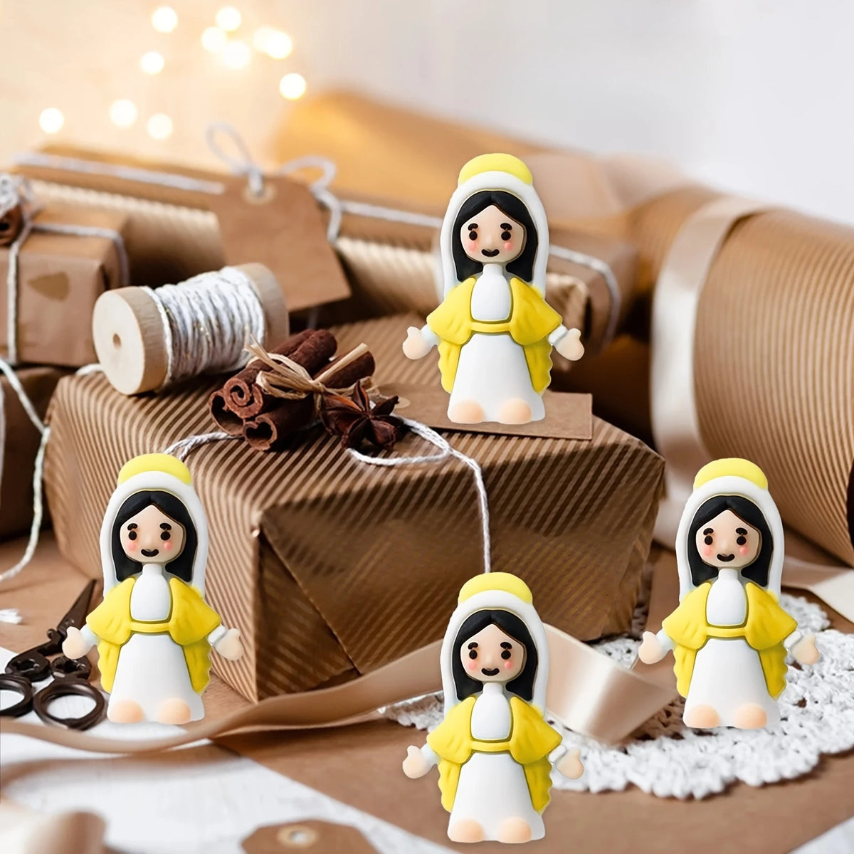 A collection of small, white and yellow mini Virgin Mary statues for religious decor displayed on brown paper.