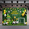 A green soccer field backdrop decorated with balloons, a trophy, and a goal net for a birthday celebration.