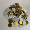 A pile of round, metallic gold and silver mosaic mirror wall decals.