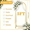 Gold metal arch backdrop stand for photography or events with sheer white draping and floral accents