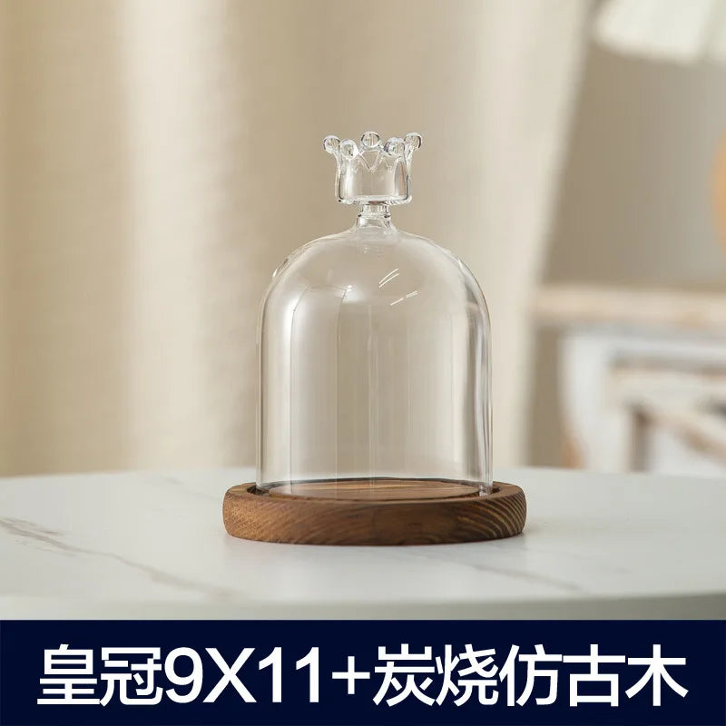 Clear glass aromatherapy candle holder with a wooden base and dust-proof cover