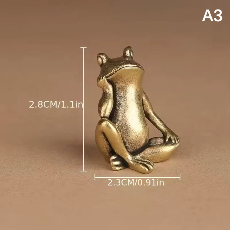 A vintage brass frog statue desktop ornament shown in a side profile against a neutral background.